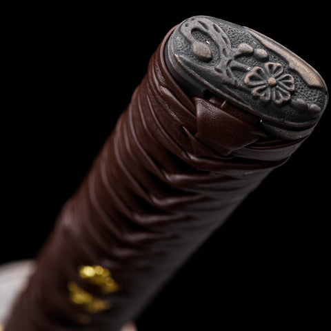 Red hamon glowing under light, adding a unique artistic element to the blade

