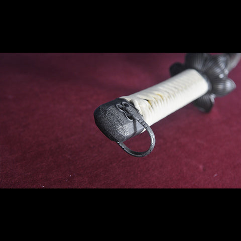Cosplay with Sekiro replica katana in costume setting
