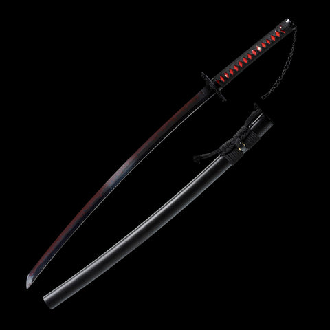 Red-black gradient blade section showing authentic clay-tempered hamon finish