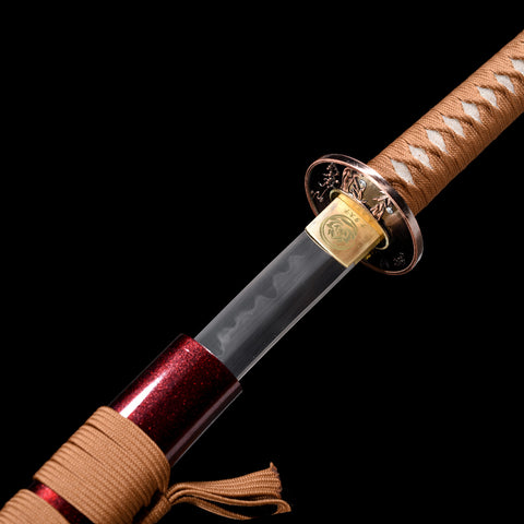 The Bloodbane sword with its dark burnt blade and crimson lacquered scabbard, standing upright.

