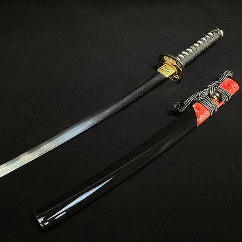 Close-up of Wakizashi blade showing clear hamon line and folded steel patterns from traditional clay tempering.
SL-327-U
