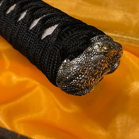 Wakizashi tsuba made of copper, intricately engraved with a traditional Japanese frog pattern.
SL-327-U

