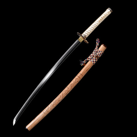 Close-up of the T10 forged steel blade, showcasing its true hamon and polished finish

