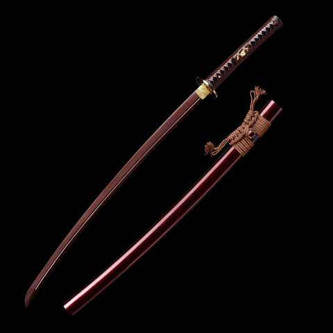 Close-up of the Folded Steel blade showcasing the unique Small Kurumaru Red Hamon

