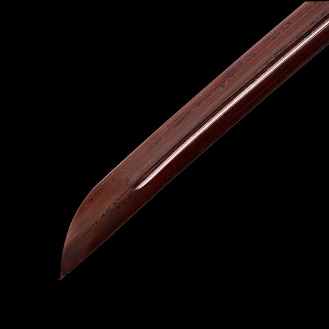 Hand-forged blade with visible folding lines and traditional Japanese craftsmanship

