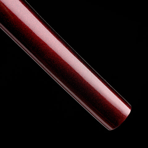 Red gloss lacquer saya providing a sleek and protective sheath for the katana

