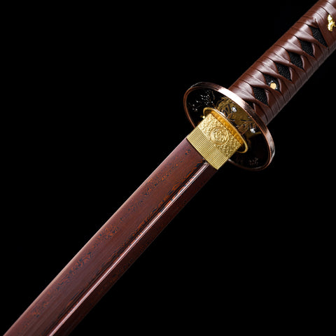 Red gloss lacquer saya providing a sleek and protective sheath for the katana

