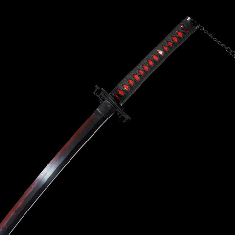 Traditional clay-tempered line detail on red-black carbon steel katana blade