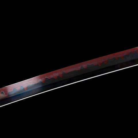 Hand-polished red-black blade surface with smooth gloss