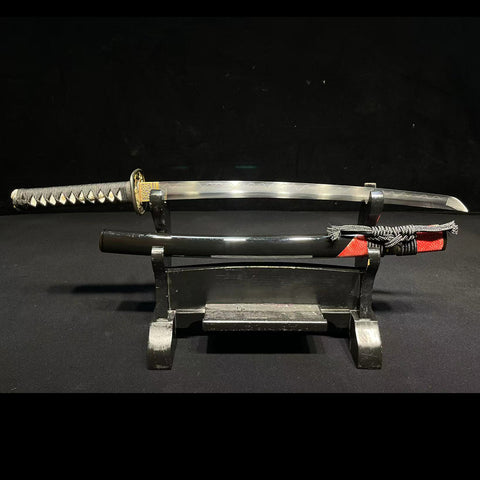 Full-length view of a Japanese Wakizashi sword crafted with Honsanmai 1095 carbon steel and folded steel, showing elegant curvature and polished blade.SL-327-U

