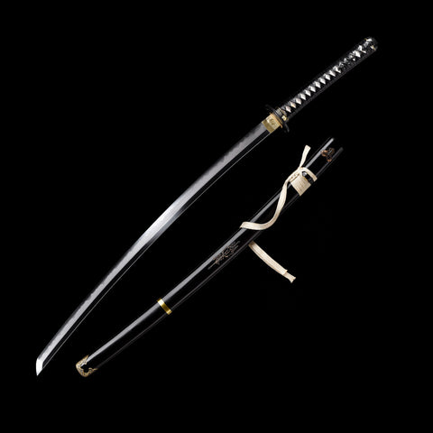 Close-up of the razor-sharp T10 Clay Tempered Steel Blade with visible hamon

