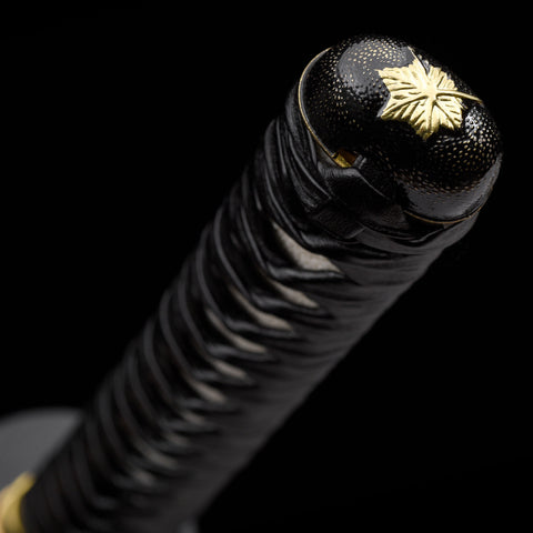 Detailed shot of the engraved Longquan hardwood saya with copper fittings

