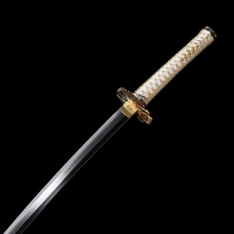 Close-up of the dragon-themed scabbard, emphasizing its fine craftsmanship

