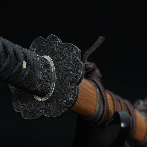Red blade katana with traditional Japanese sword curvature and design

