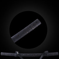 Gold kanji on black leather-textured base saya