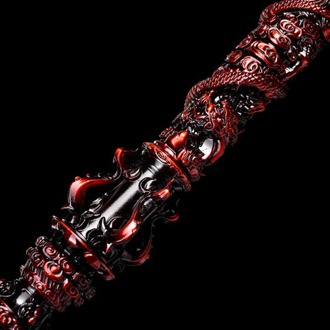 Collector's edition display of the Wukong Ruyi Jingu Bang replica with shadow-rich lighting, emphasizing premium red-black alloy components and gold inscriptions

QQhsjgb