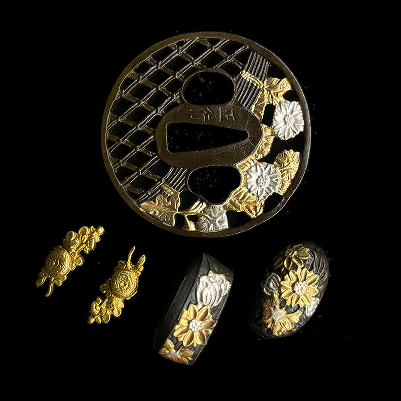 Copper Tsuba gilded with gold and silver. 